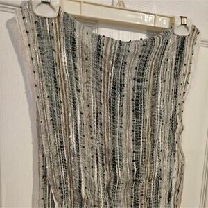 Woman's multi-colored scarf with metallic threads and fringe